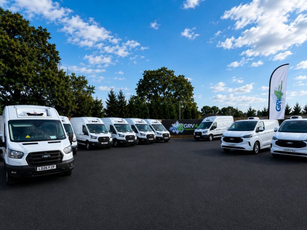 A line of GRV 4 Fridge Vans Ford Transit and Transit Custom fridge vans in the yard at KBF House, Burgess Hill