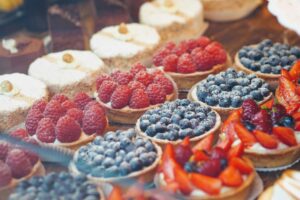 Bakery counter with fruit tarts and cakes